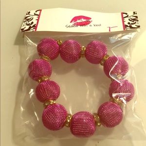 Hot pink/gold mesh orb stretch bracelet.